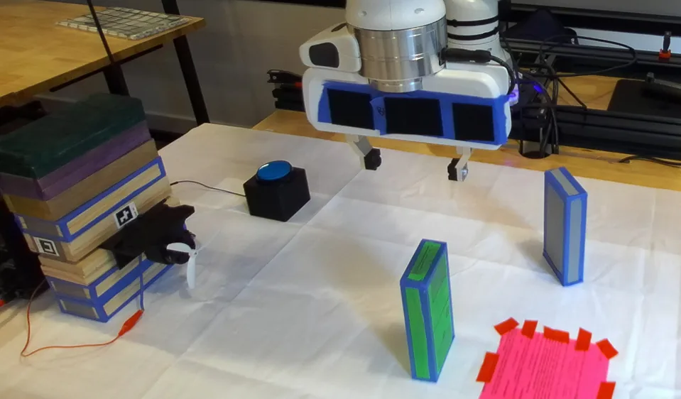 The robot has placed the green block.