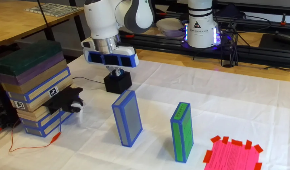 The robot presses the fan button.